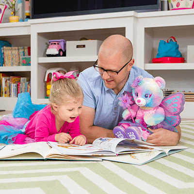 child and adult reading together child and adult reading together