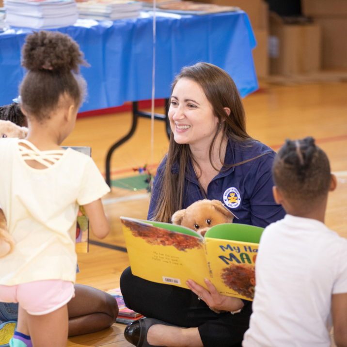 Build-A-Bear Associate Reading To Children