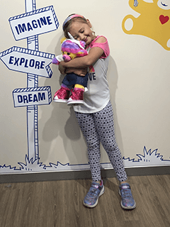 Child Hugging Stuffed Bear Tightly